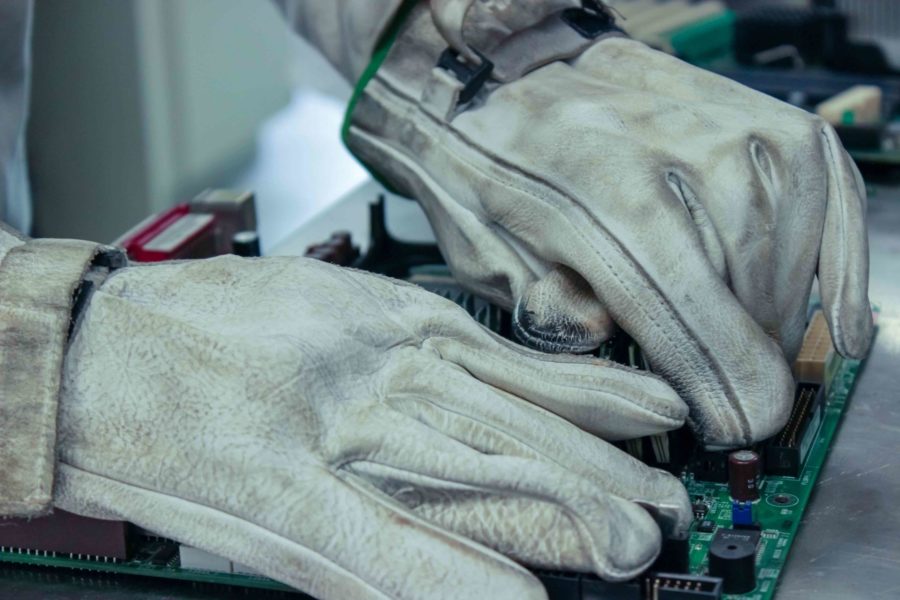 gloves working on electronic recycling