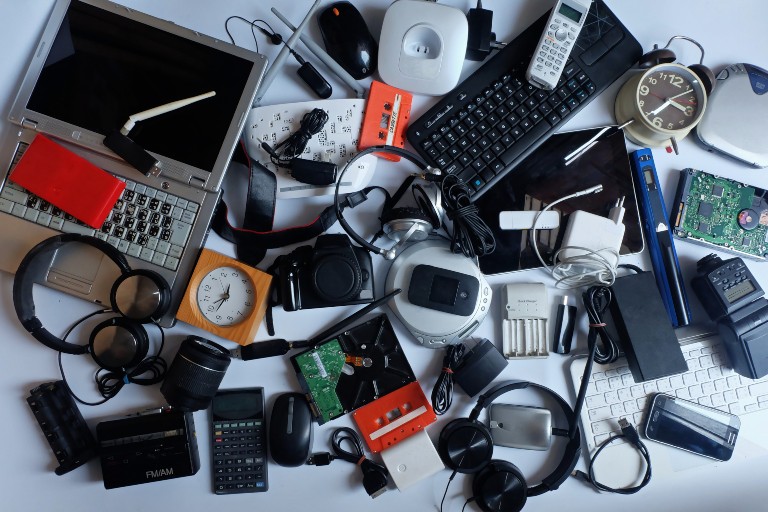 old electronics in a pile