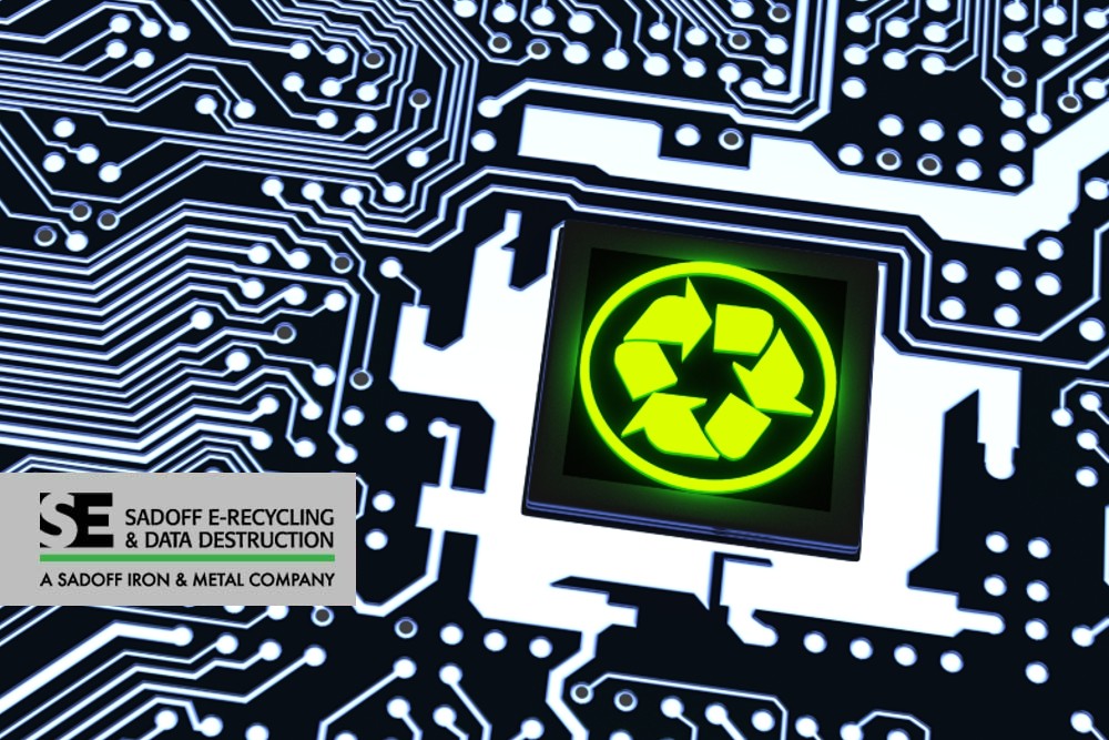 Black circuit board with recycling symbol lit up and Sadoff logo