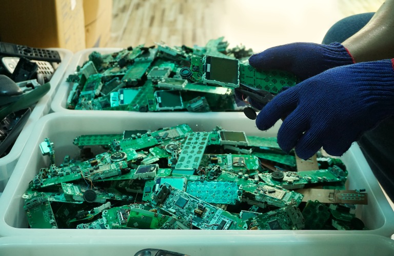Person sorting circuit boards