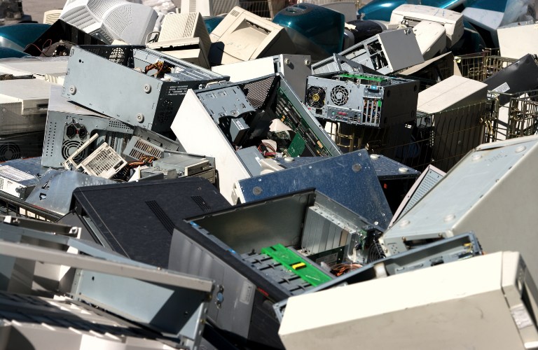A pile of old desktop computers