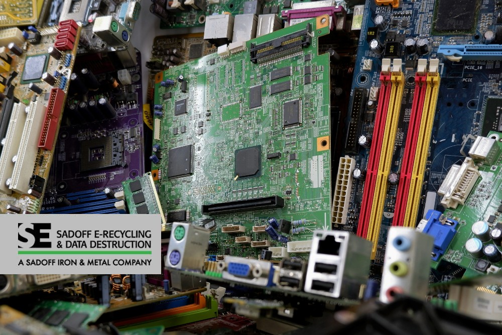Motherboards in a pile and Sadoff logo