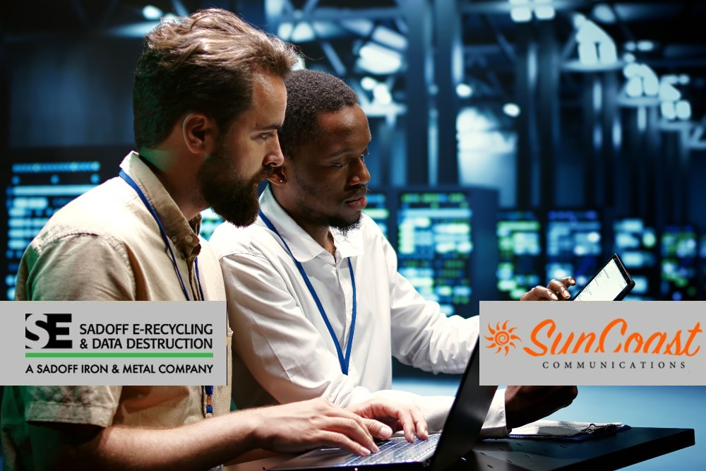 Two men reviewing computers in a data center and Sadoff + SunCoast logo