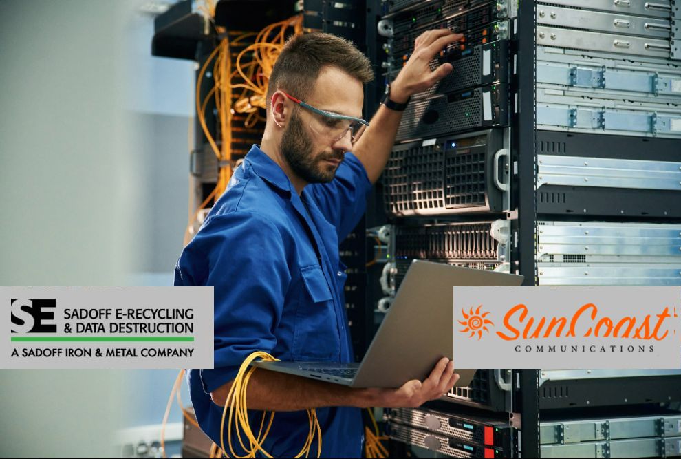 Man working with stored tech with Sadoff and SunCoast logos