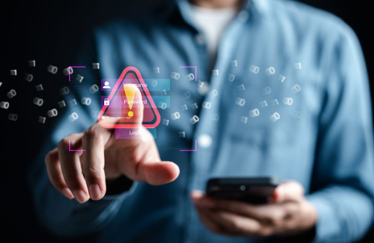 man pushing a red exclamation holding a phone